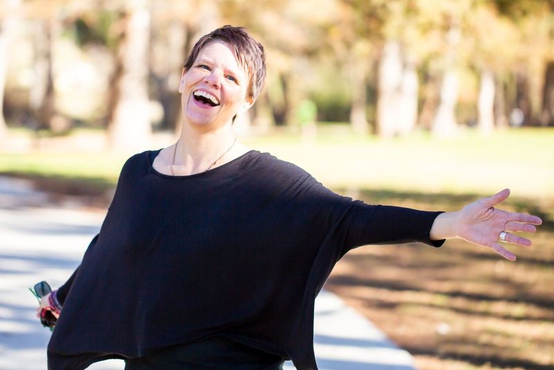 Tara Moorman laughing by the river